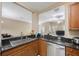 Spacious kitchen with stainless steel sink and a breakfast bar overlooking the living room at 8004 Downpatrick Ct, Tampa, FL 33610