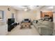 Open-concept living and dining area with neutral paint and ceiling fan at 8004 Downpatrick Ct, Tampa, FL 33610