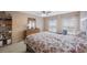 Carpeted main bedroom with natural light, a ceiling fan, and furnishings at 8004 Downpatrick Ct, Tampa, FL 33610