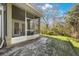 Exterior of screened in porch with access to backyard and wooded area at 8004 Downpatrick Ct, Tampa, FL 33610