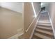 Carpeted staircase with white railing leading to the upper level at 8004 Downpatrick Ct, Tampa, FL 33610