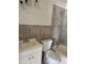 Functional bathroom featuring tiled walls, a vanity, toilet, and a combined bathtub and shower at 808 20Th W Ave, Bradenton, FL 34205