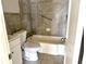 Bathroom showcasing a vanity, toilet, tub, and tiled walls at 808 20Th W Ave, Bradenton, FL 34205