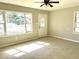 Bright living room featuring tile floors, a ceiling fan, and an entrance at 808 20Th W Ave, Bradenton, FL 34205