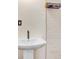 Close up of bathroom vanity with white vessel sink, dark faucet and subway tile at 9040 Lunar Ln, Port Richey, FL 34668