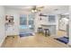 Eat-in kitchen with stainless steel appliances, ample counter space, and sliding door access to pool at 9040 Lunar Ln, Port Richey, FL 34668