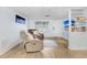 Comfortable living area with neutral colors, two recliners, and contemporary decor, perfect for relaxation at 9040 Lunar Ln, Port Richey, FL 34668