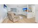 Cozy living room with contemporary flooring, neutral decor, and ample natural light at 9040 Lunar Ln, Port Richey, FL 34668