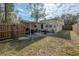 Spacious backyard view highlighting the patio, fence, and the yellow exterior of the home at 1053 56Th N Ave, St Petersburg, FL 33703