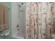 Bathroom with a tub, shower head, and a decorative shower curtain at 1053 56Th N Ave, St Petersburg, FL 33703