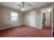 Bedroom with neutral walls, window, and a door to the bathroom at 1053 56Th N Ave, St Petersburg, FL 33703