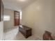 Inviting entryway featuring tiled floors and a classic wooden chest, offering a warm welcome at 1053 56Th N Ave, St Petersburg, FL 33703