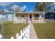 Adorable bungalow featuring a quaint front porch and well-kept lawn at 1053 56Th N Ave, St Petersburg, FL 33703