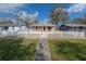 Charming home with a white picket fence and a well-manicured front yard at 1053 56Th N Ave, St Petersburg, FL 33703