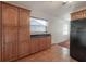 Kitchen features ample wood cabinet space, tile flooring, and a black refrigerator at 1053 56Th N Ave, St Petersburg, FL 33703