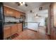 Functional kitchen with wood cabinets, stainless steel appliances, and tile flooring at 1053 56Th N Ave, St Petersburg, FL 33703