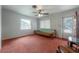 Bright living room with a ceiling fan, futon, and natural light at 1053 56Th N Ave, St Petersburg, FL 33703