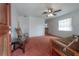 Cozy living room with a futon, rocking chair, and ceiling fan at 1053 56Th N Ave, St Petersburg, FL 33703