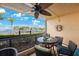 Enjoy stunning views from this serene balcony with table, chairs, and ocean view at 1060 Pinellas Bayway S # 103, St Petersburg, FL 33715