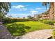 Professionally landscaped grounds with brick pathway and trimmed hedges at 1060 Pinellas Bayway S # 103, St Petersburg, FL 33715