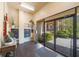 Entrance hallway with dark wood floors, mailboxes, and access to the outside courtyard at 1060 Pinellas Bayway S # 103, St Petersburg, FL 33715