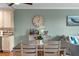 Dining area with wooden table and seating, with view to kitchen at 112 Brent Cir, Oldsmar, FL 34677