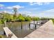 Waterfront views with boat dock and lush green landscaping at 112 Brent Cir, Oldsmar, FL 34677