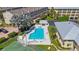 Aerial view of community pool, tennis court, and well-maintained landscaping at 1125 Pinellas Bayway S # 305, St Petersburg, FL 33715