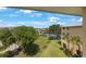 Scenic aerial view of a waterfront property featuring lush greenery and neighborhood boat docks at 1125 Pinellas Bayway S # 305, St Petersburg, FL 33715