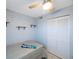 Serene bedroom with a ceiling fan, closet, and built-in shelves at 1125 Pinellas Bayway S # 305, St Petersburg, FL 33715