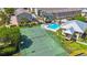 Aerial view of tennis court and community pool at 1125 Pinellas Bayway S # 305, St Petersburg, FL 33715