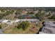 An aerial shot shows the property with mature trees, green space, and a pond enhancing the community's appeal at 11410 Carriage Hill Dr # 3, Port Richey, FL 34668