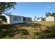 Backyard featuring a shed at 1152 Viking Dr, Holiday, FL 34691