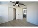 Bedroom featuring a closet, ceiling fan, and a view into the adjacent kitchen at 1152 Viking Dr, Holiday, FL 34691