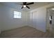 Comfortable bedroom featuring wood-look floors, closet, and an open door to another room at 1152 Viking Dr, Holiday, FL 34691