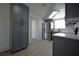 View of the kitchen with modern stainless steel appliances and shaker cabinets at 1152 Viking Dr, Holiday, FL 34691