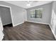 This bedroom features a ceiling fan, wood flooring and a walk in closet at 11901 4Th N St # 10102, St Petersburg, FL 33716