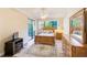 Bright bedroom featuring wood furnishings, including a bed, dresser and a ceiling fan at 12607 San Blas Loop, Largo, FL 33774