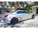 A silver Infiniti G37S stands parked in front of a house in the driveway at 12607 San Blas Loop, Largo, FL 33774