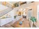 Dining area next to the staircase offering views to the kitchen and the home's foyer at 12607 San Blas Loop, Largo, FL 33774