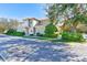 Well-manicured townhome with mature landscaping and a neutral color palette at 12607 San Blas Loop, Largo, FL 33774