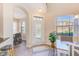 Bright foyer features a decorative glass front door, tile flooring, and views into the dining area at 12607 San Blas Loop, Largo, FL 33774