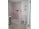 Bathroom with decorative wall tiles in shower area and tiled floors, and fixtures at 1321 W North B St, Tampa, FL 33606