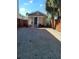 Charming home exterior with tidy yard, gravel driveway, and mature landscaping at 1321 W North B St, Tampa, FL 33606