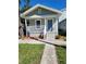 Charming single-story home features a welcoming front porch and manicured landscaping at 1321 W North B St, Tampa, FL 33606