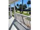 Inviting front porch showing white railings, sunny skies and neighborhood trees at 1321 W North B St, Tampa, FL 33606