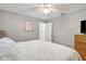 Bedroom with closet and open doorway featuring carpet flooring, and bed with starfish patterned comforter at 13855 Rudi Loop, Spring Hill, FL 34609