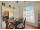 Comfortable dining area with wood floors and natural light at 13855 Rudi Loop, Spring Hill, FL 34609