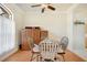 Cozy dining room with wood floors, a round table, and traditional furniture at 13855 Rudi Loop, Spring Hill, FL 34609