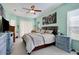 Charming main bedroom suite with large windows and elegant furnishings at 13855 Rudi Loop, Spring Hill, FL 34609